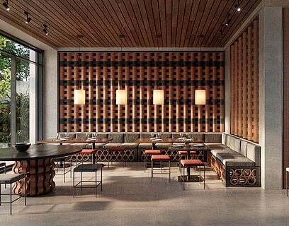 Interior de restaurante con sistema modular cerámico O-Buit de Gresmanc Group, con piezas extrusionadas en terracota formando composición tridimensional en pared de fondo
