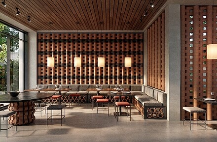 Interior de restaurante con sistema modular cerámico O-Buit de Gresmanc Group, con piezas extrusionadas en terracota formando composición tridimensional en pared de fondo