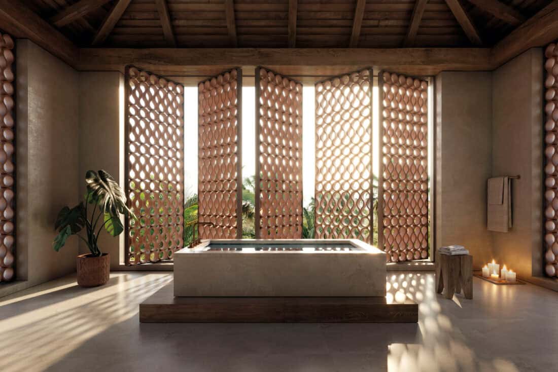 t: Espacio spa con celosías de cerámica extrusionada O-Buit de Gresmanc filtrando luz natural sobre bañera exenta de piedra y techo de madera